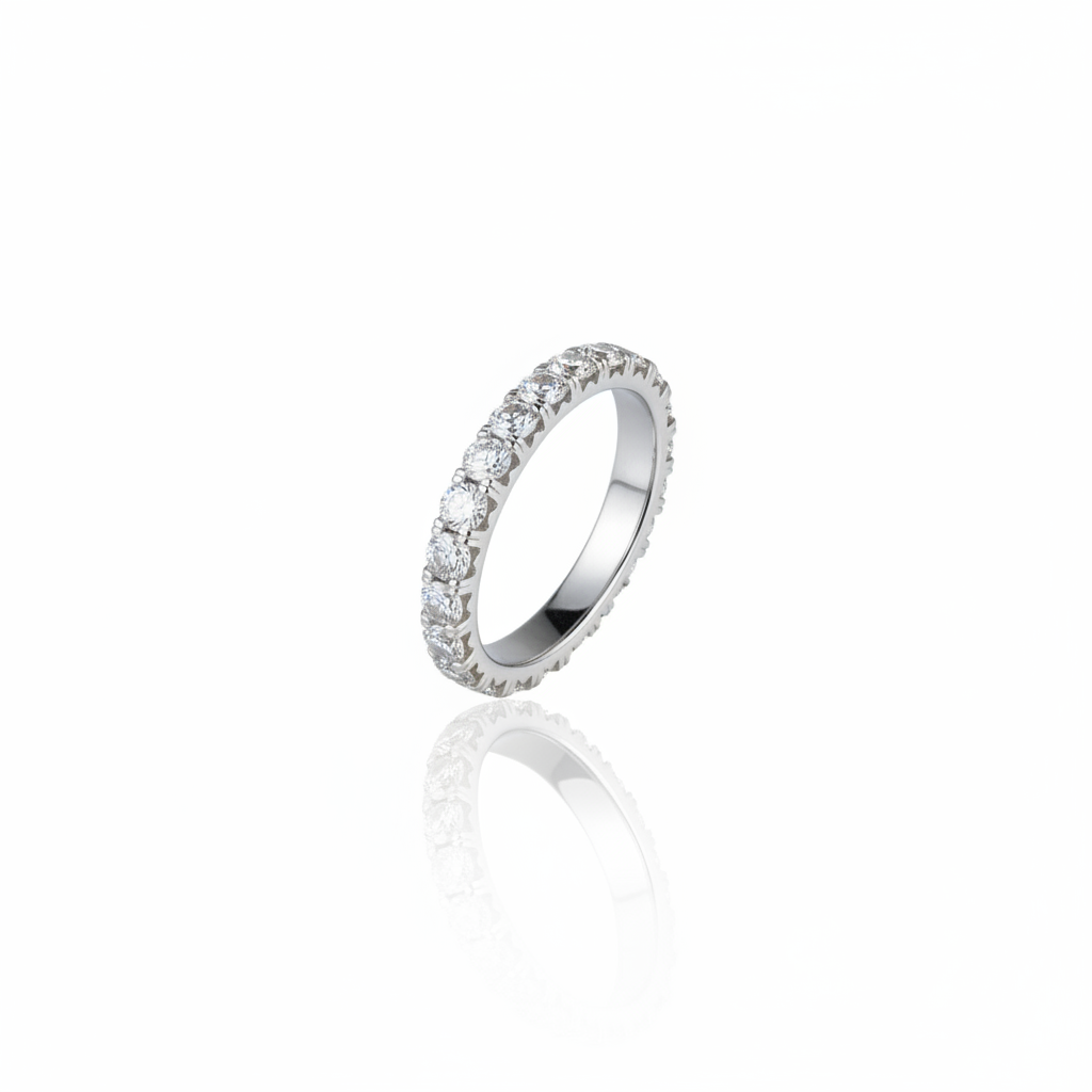 Diamond eternity ring on white background with reflection