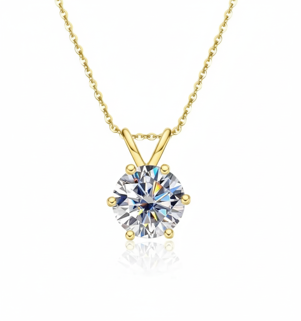 Diamond solitaire pendant in yellow gold on pure white background