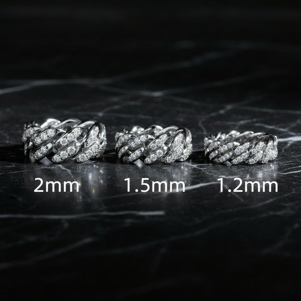 Moissanite Cuban link rings on black marble with white text
